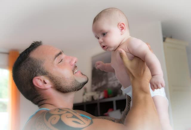 Father holding baby